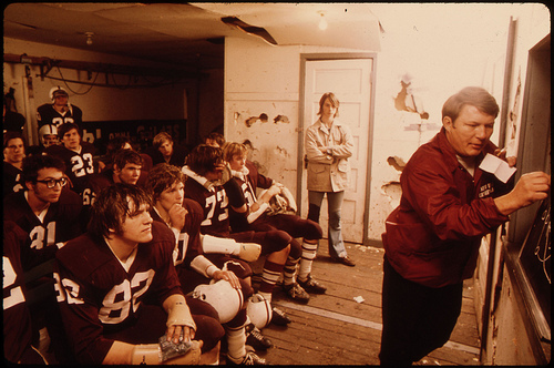 Pregame Discussion by the Coach for Cathedral Senior High School Football Players Prior to a Game at Johnson Park in New Ulm Minnesota...