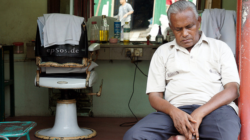 old hairdresser sleeping at work